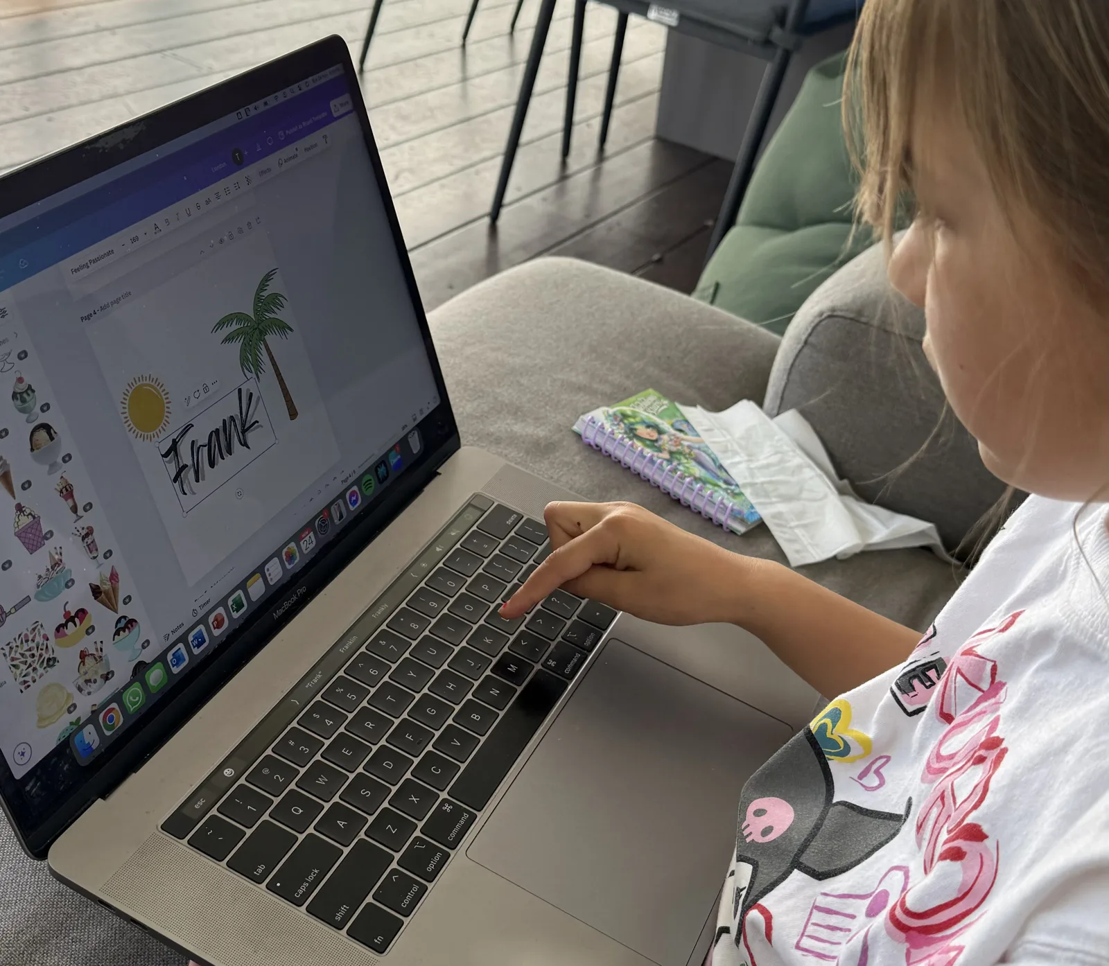 London at the laptop, laying out a sun, palm tree and the name Frank for a cap